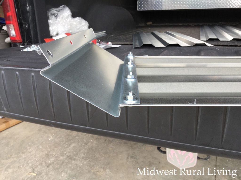 Assembling the end pieces of the Castlecreek Large Galvanized Raised Bed Planter Box